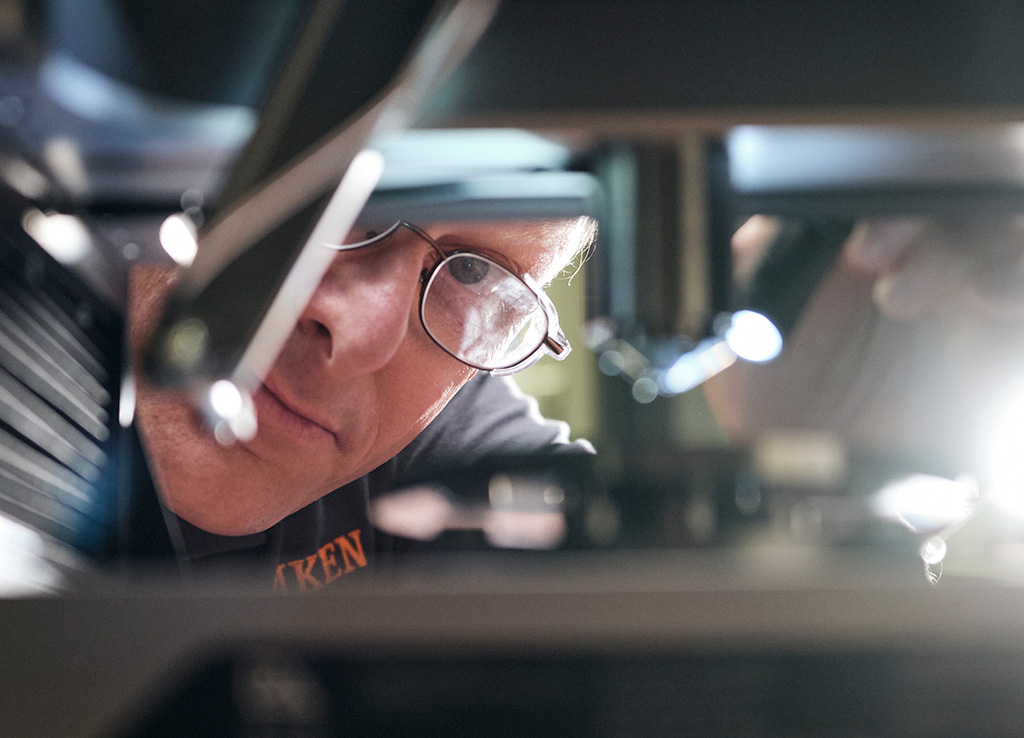 Photograph of a Timken Specialist using testing equipment.