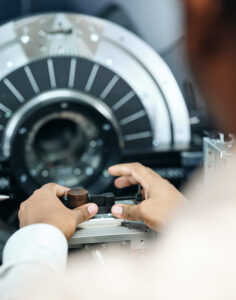 Close up photograph of a Timken technician's hands.